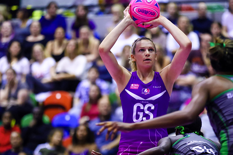 a netball player holding the ball